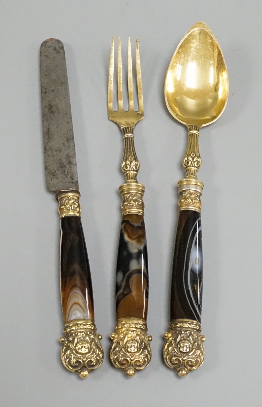 A 19th century French gilt white metal and agate mounted three piece cutlery set, knife 20.5cm.